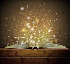 an open book with sparkles coming out of the pages.