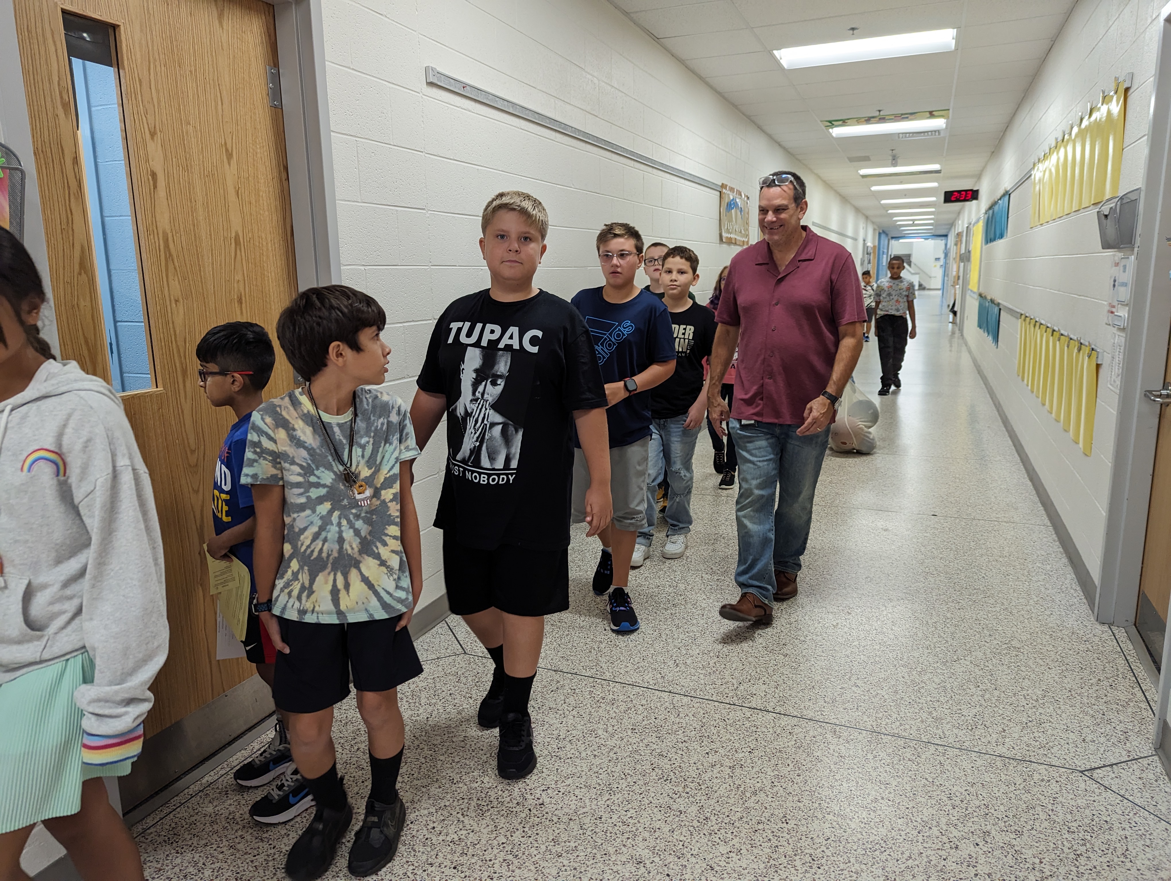 5th grade students walking to recess.